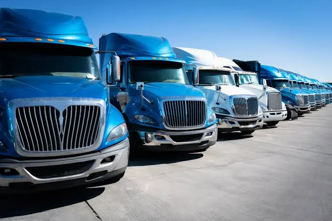 What Is Linehaul Transportation - row of semi trucks parked in a fleet yard ready for long haul freight
