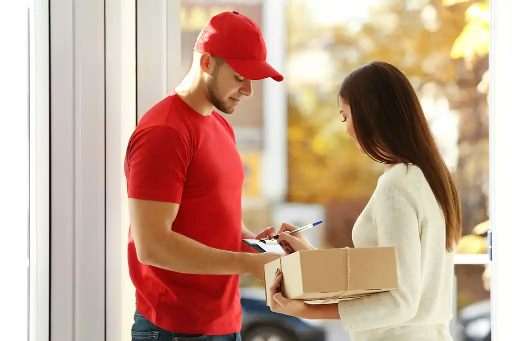 Courier delivering package to customer what is courier service explained