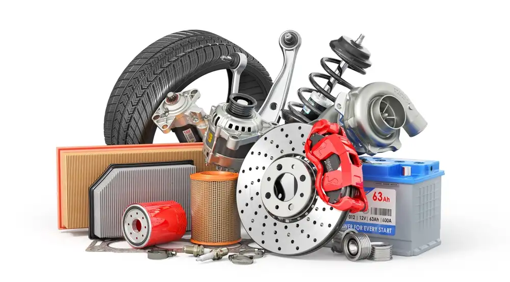 What Does an Auto Parts Delivery Driver Do – a collection of auto parts including brake discs, filters, battery, suspension components, and tires prepared for delivery to auto repair shops and customers.